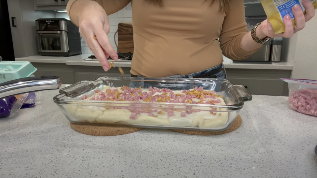 Lindsey pouring her toppings onto the gravy