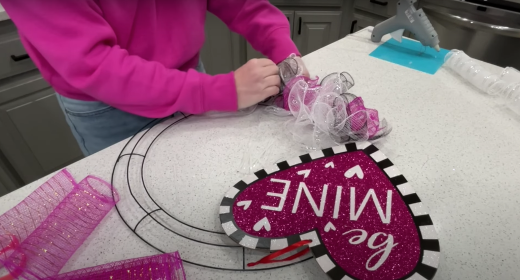 attaching mesh ribbon bunches to wreath frame