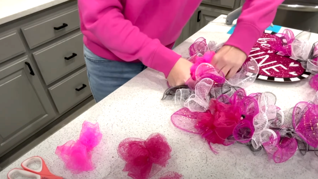 adding loofah puffs to wreath