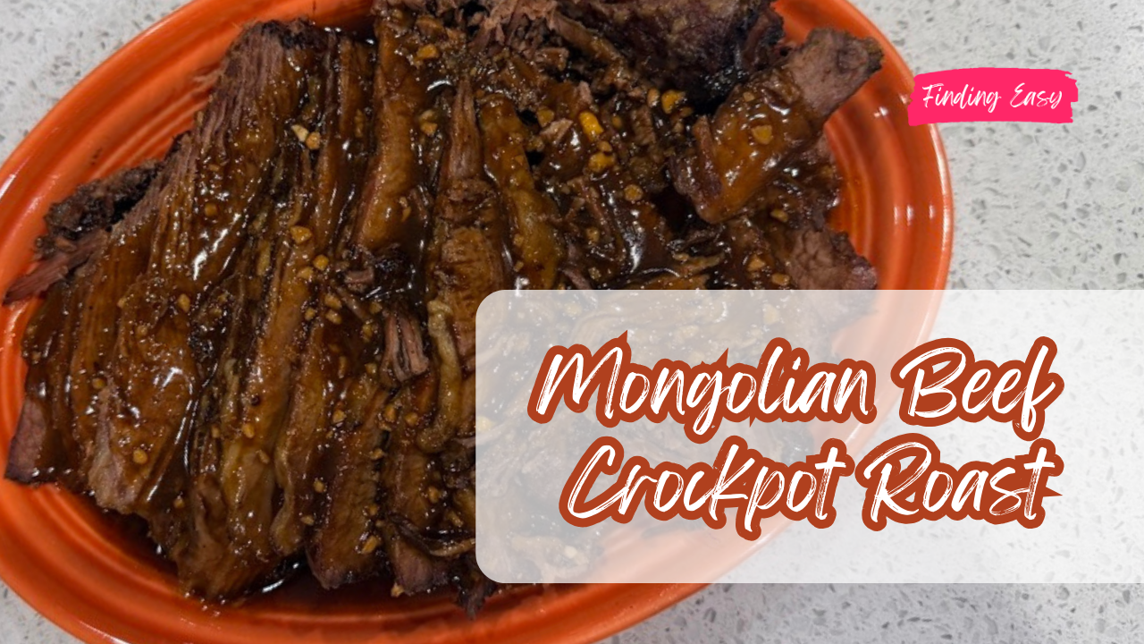 Slow cooker Mongolian beef chuck roast covered in savory brown sugar soy sauce gravy inside a crockpot.